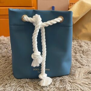 NEW—Dolce & Gabbana pouch/ handle bag converted into crossbody.